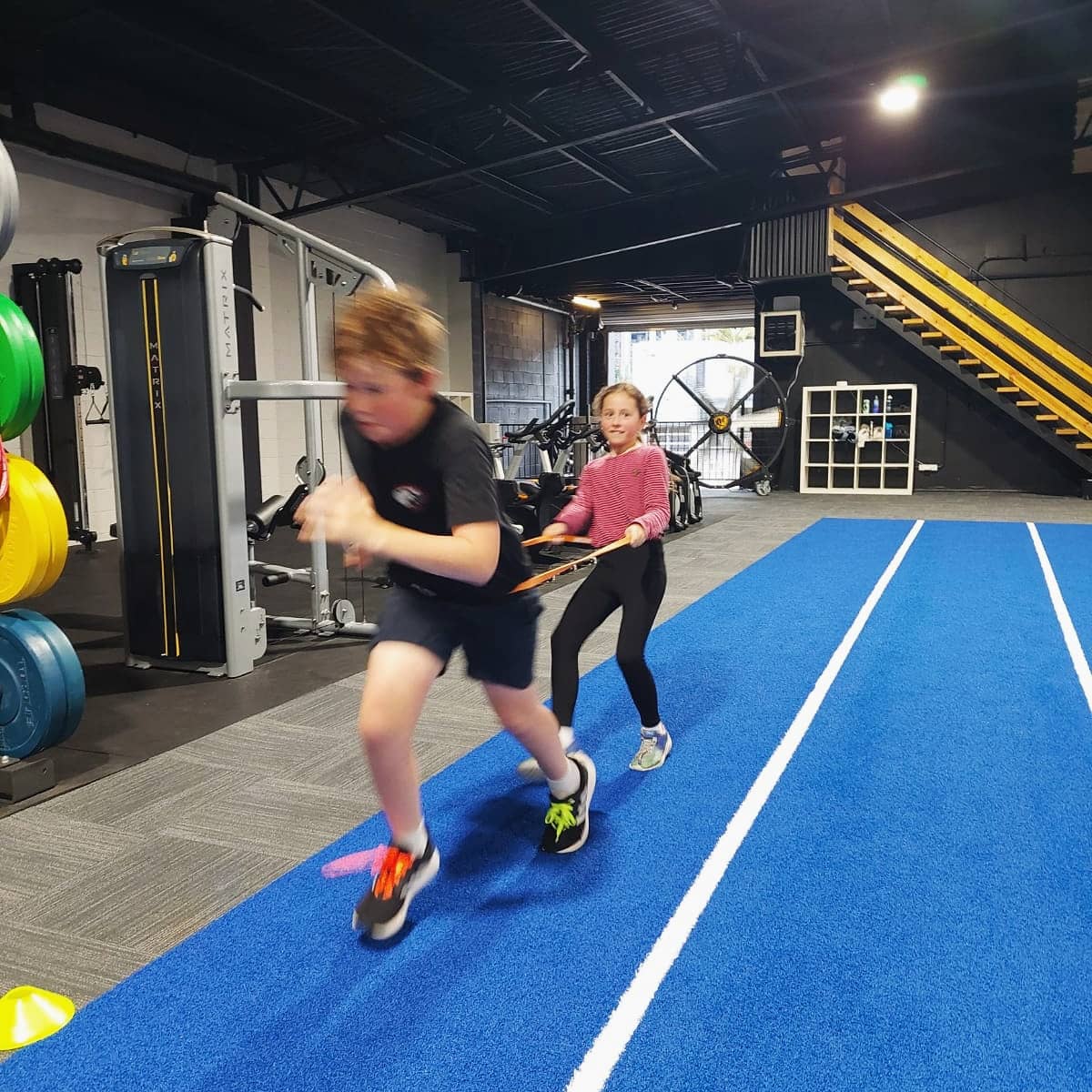 Youth Fitness Foundations class at ATHLETIX Brisbane — kids training speed and resistance work